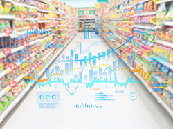 商品が並ぶスーパーマーケットの通路に売上データのグラフが重ね表示された構図