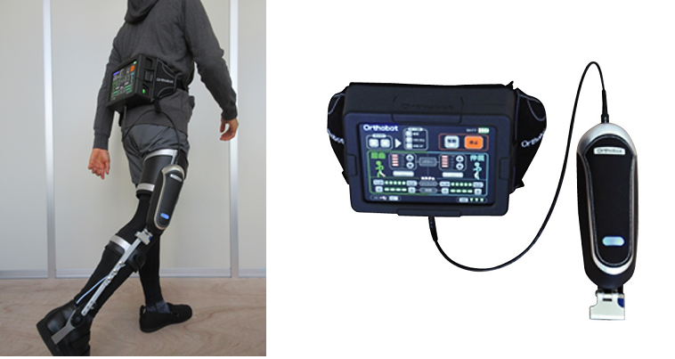 Orthobotの本体ユニットと腰に装着する操作パネルの写真